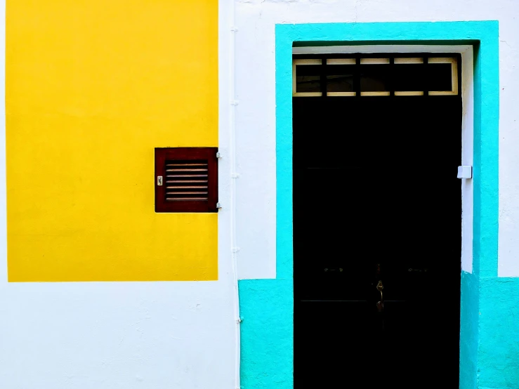 an opened door and window on a building