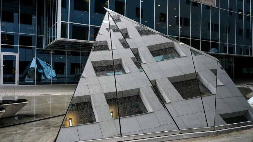 modern art sculpture designed with many windows near building