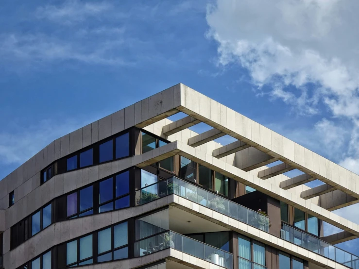 the corner of an office building with balconies on it