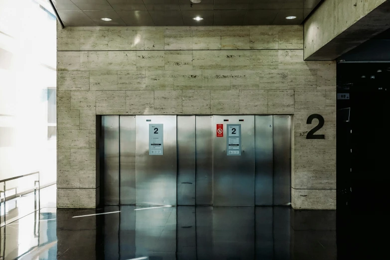 there are two elevators that are closed in this large building