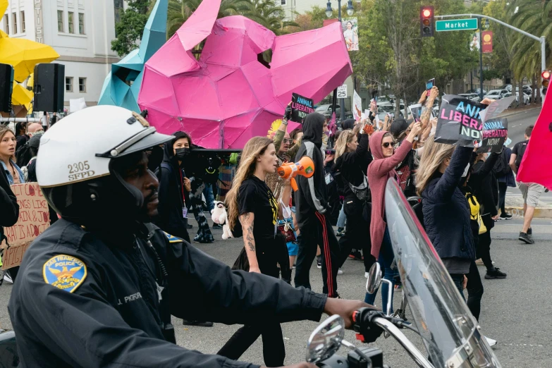 a man with a helmet holding a motorcycle handlebar