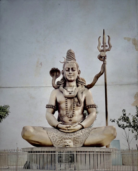 a very large statue of lord ganesh in front of a building