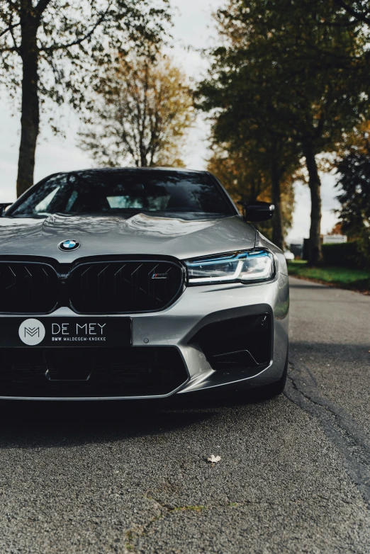 a grey and black sports car on a city street