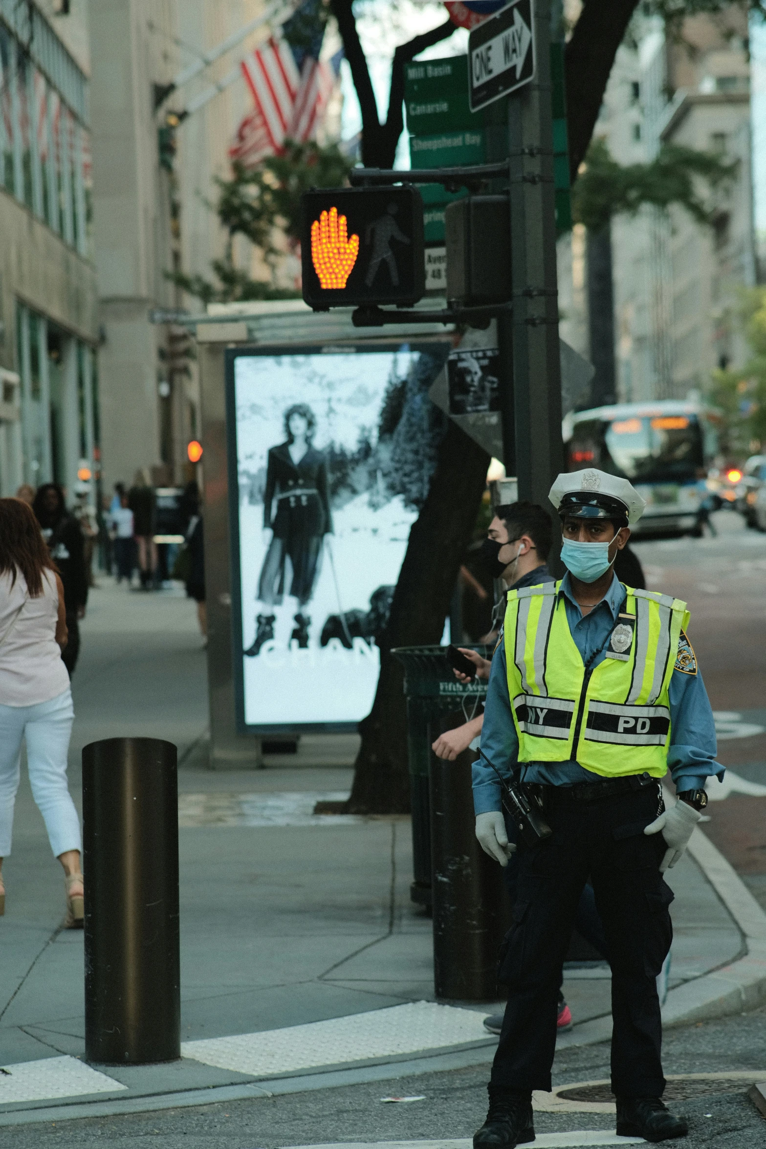 there is a police officer standing at a street corner