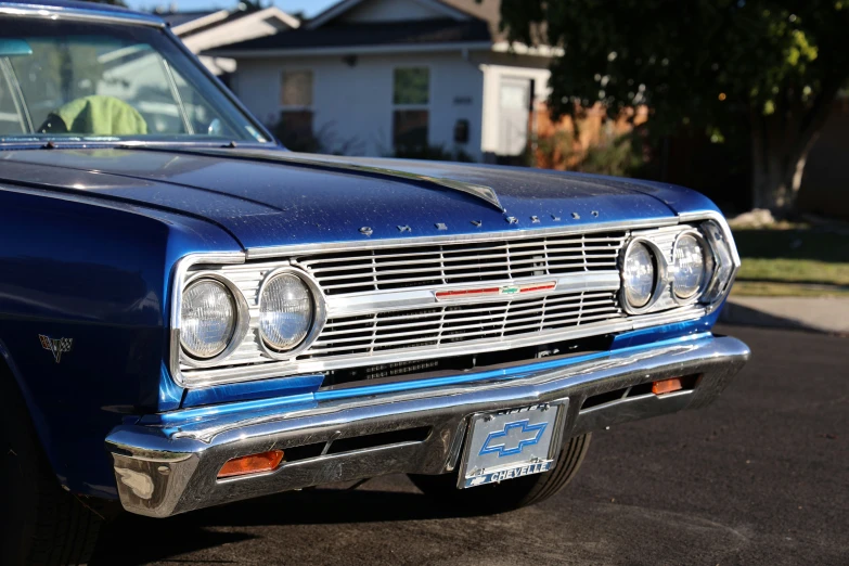 a vintage blue station wagon car in a residential neighborhood