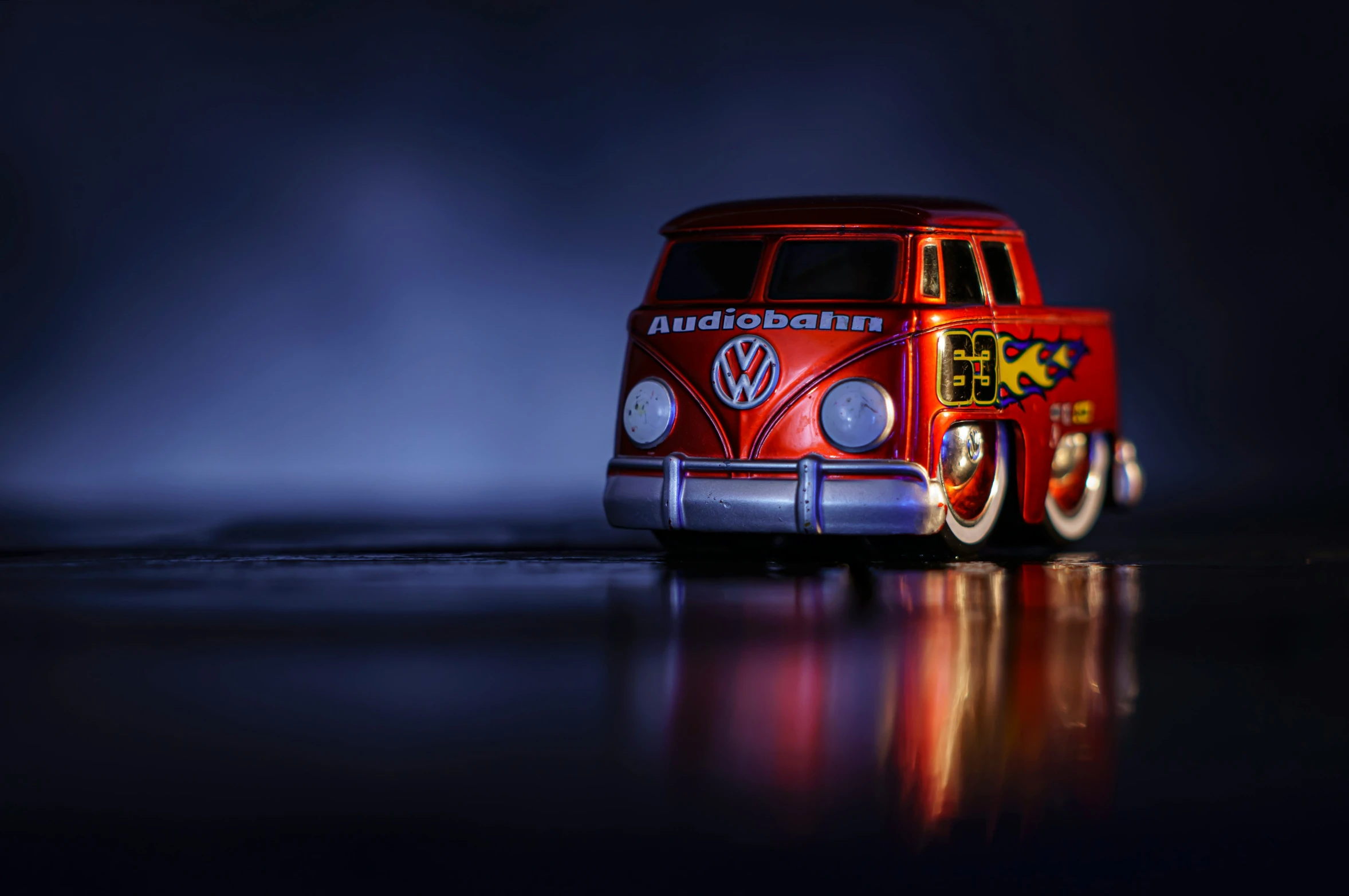 an old vw bus is on the dark surface