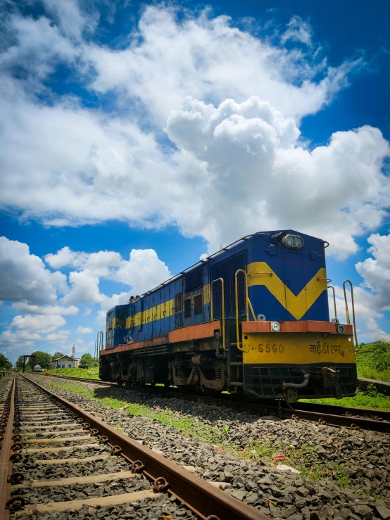 a freight train sitting on a rail road track