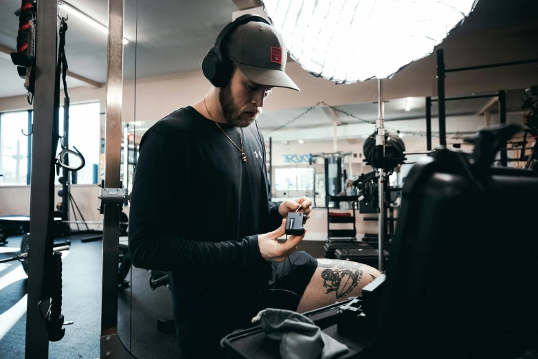 a man is getting his leg tattoo before a session