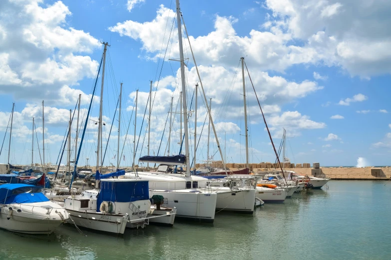 a small marina with several small boats lined up