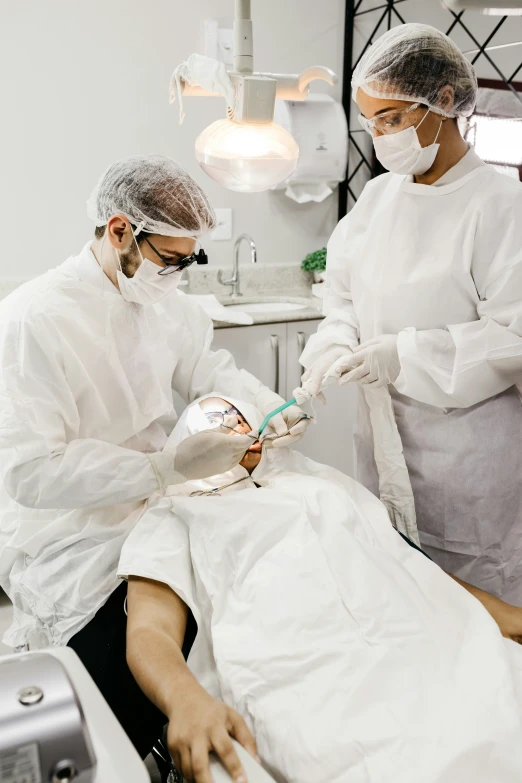 two people are performing a  on a patient