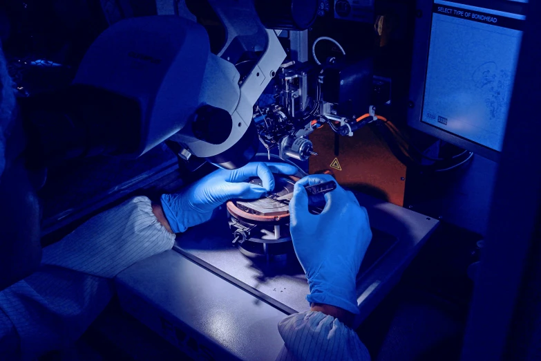 a person is operating the electronic equipment on the table