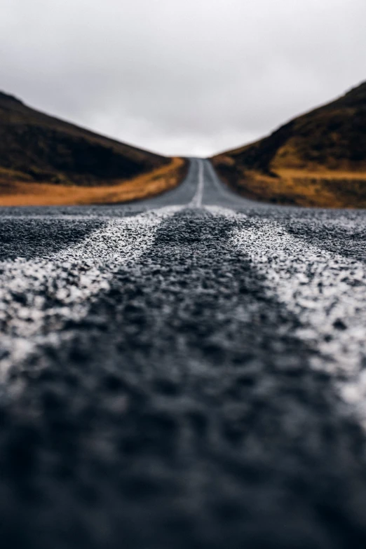 the gravel on the road has black marks