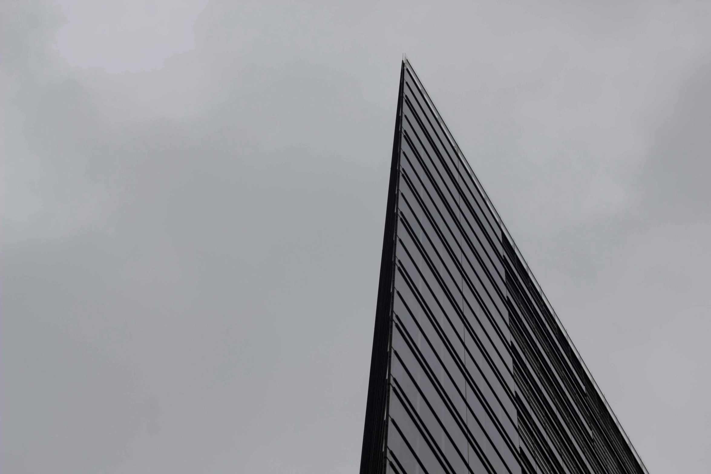 a plane is flying by an office building