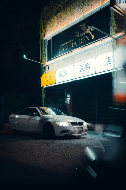 a car parked in front of a business on the street