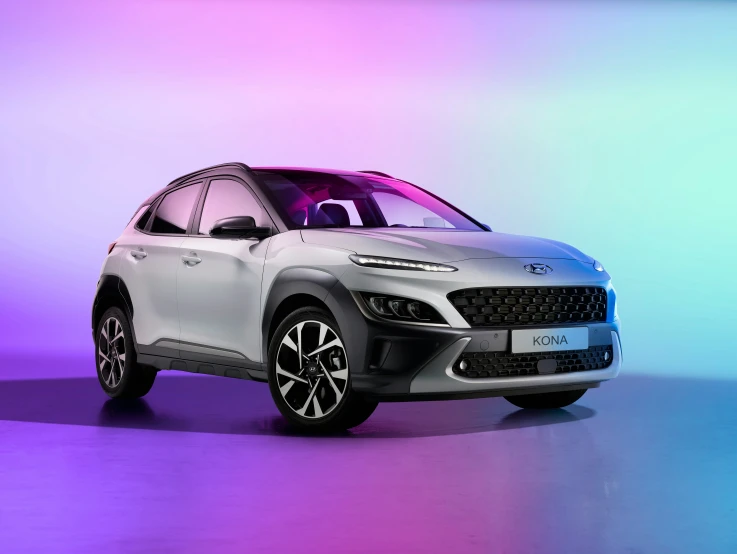 the hydrogen suv is parked in front of a colorful background