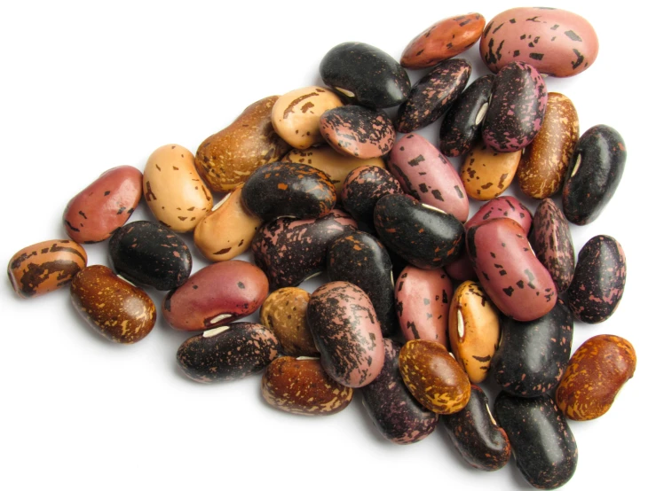 a group of speckled, brown and black peanuts