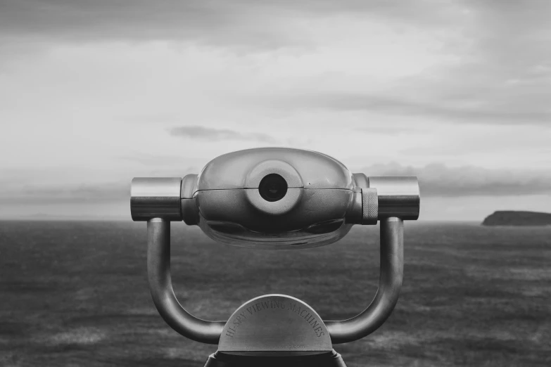 a telescope on top of a wooden pole