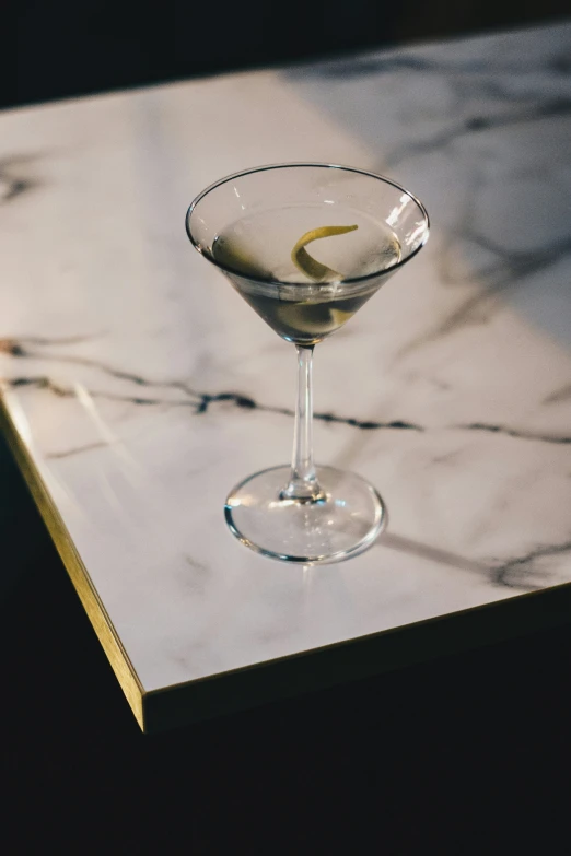 a martini drink is sitting on the bar