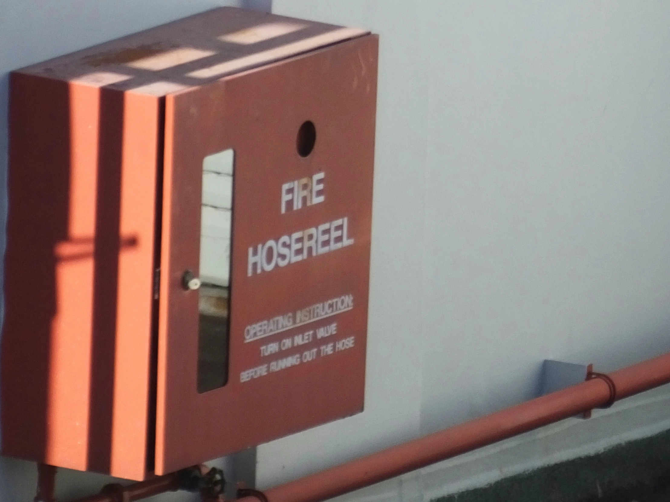 a close up s of a fire hose rack sign