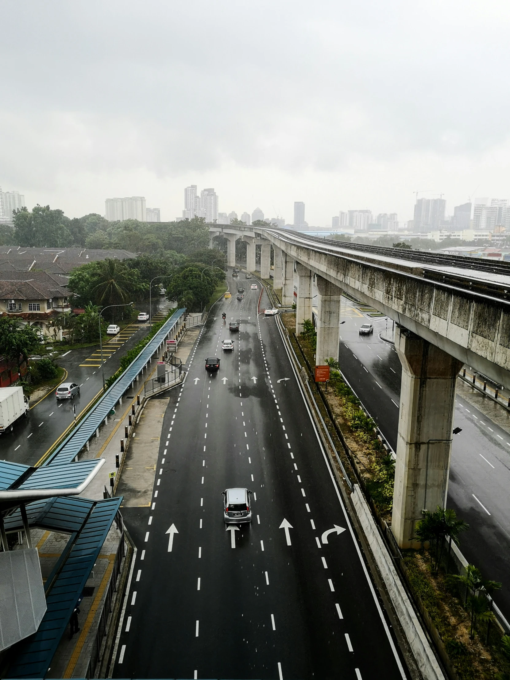 a bridge and roadway on a very rainy day