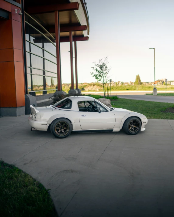 a white car parked on the side of the street