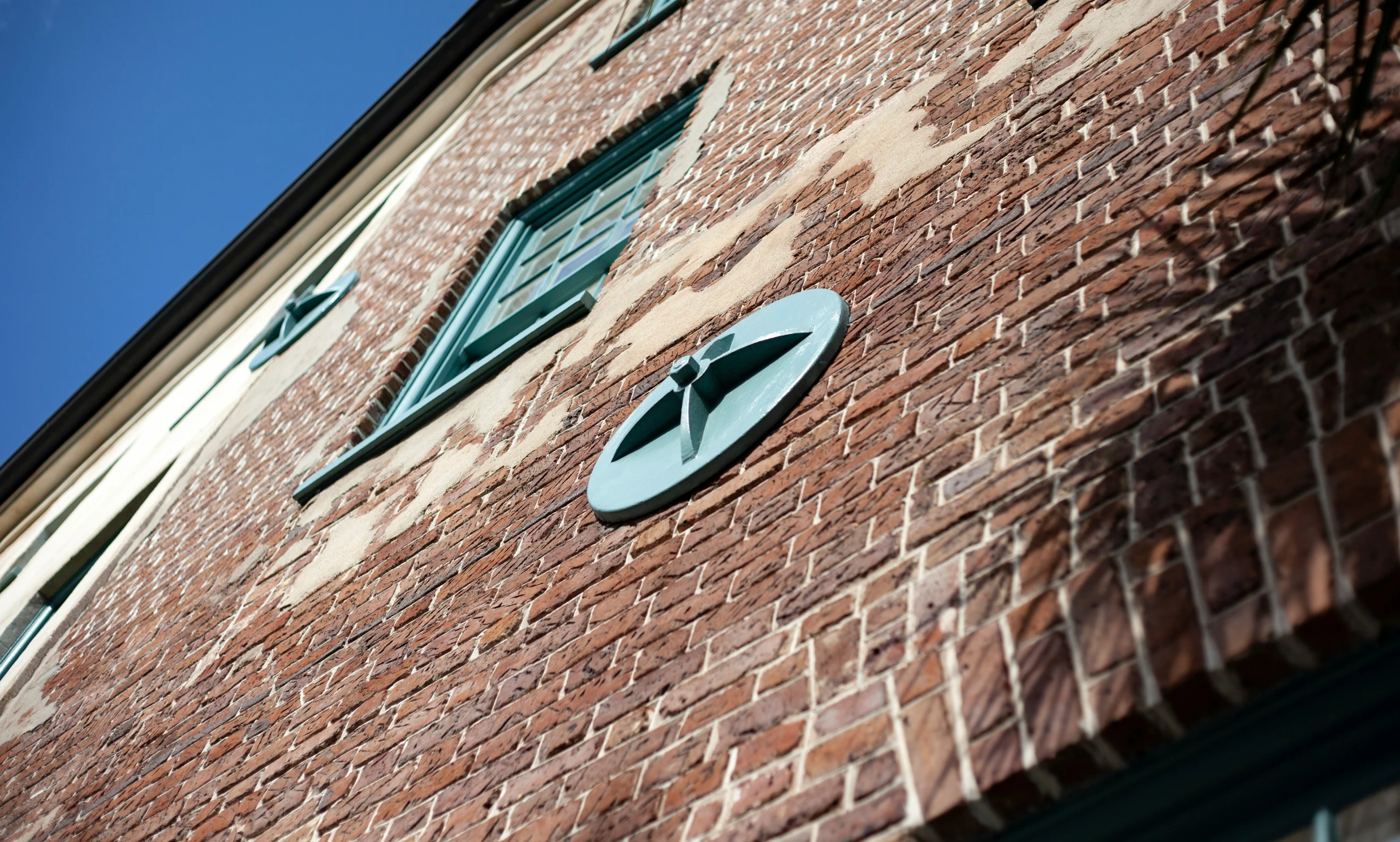 the clock on the side of the building shows 4 o'clock