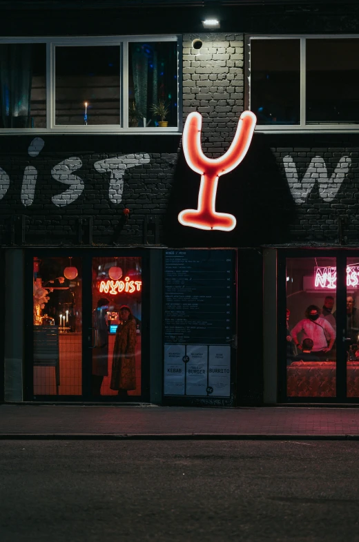 neon sign outside a restaurant at night time