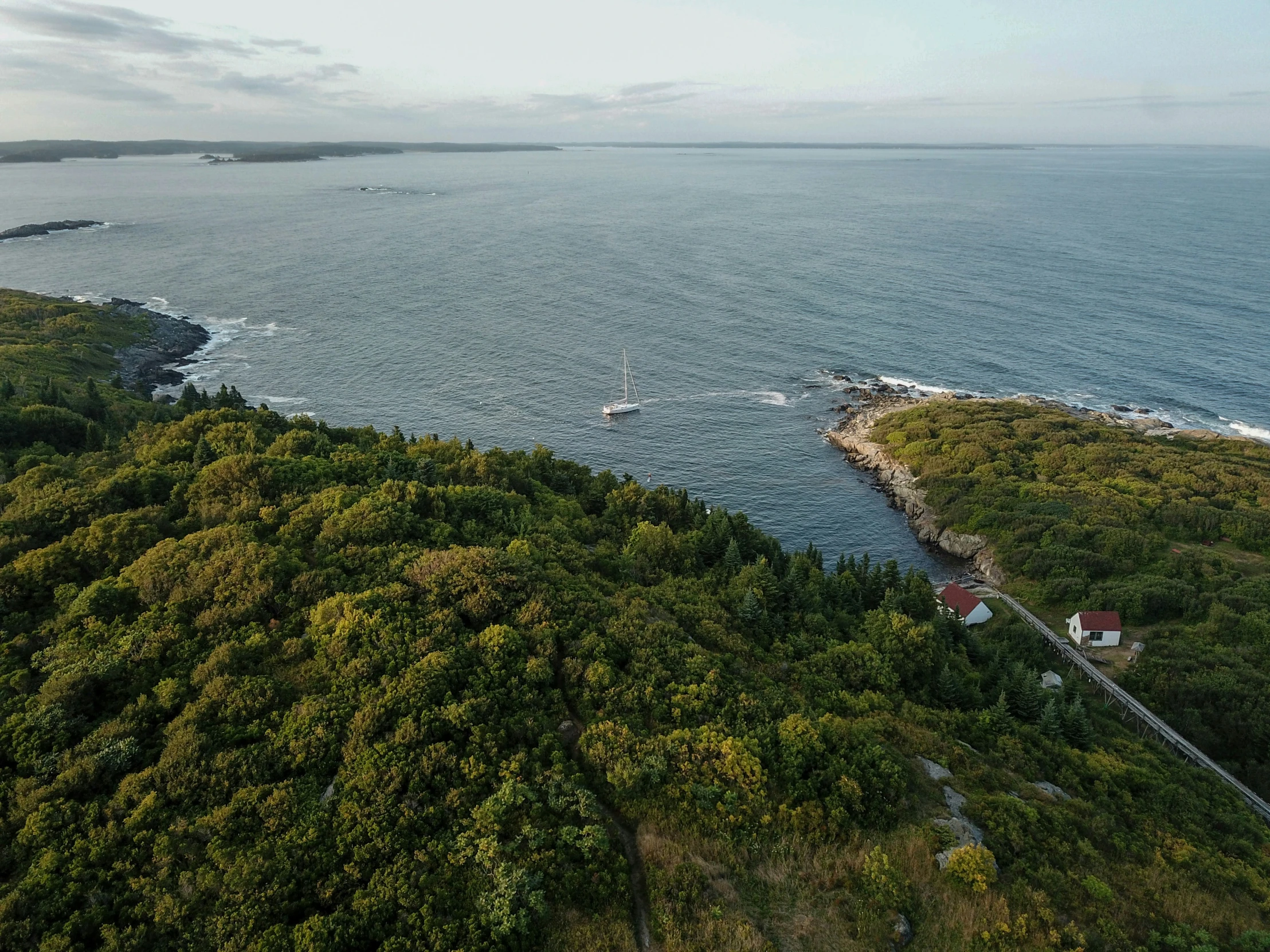 an island off the coast with water on top