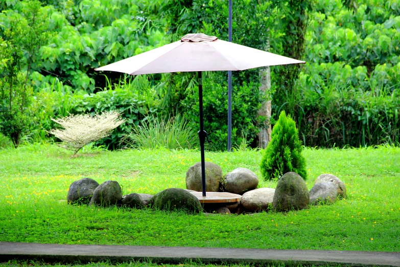 an umbrella sitting over a small fire pit