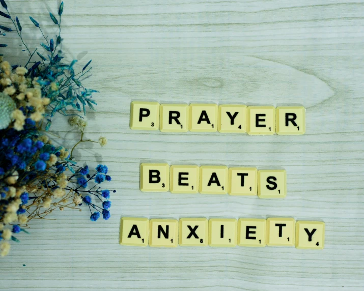 the words prayer, beat, and anxiety spelled with blocks