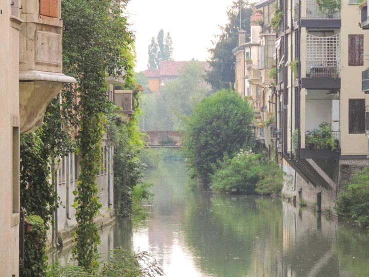 a narrow canal running through a small town