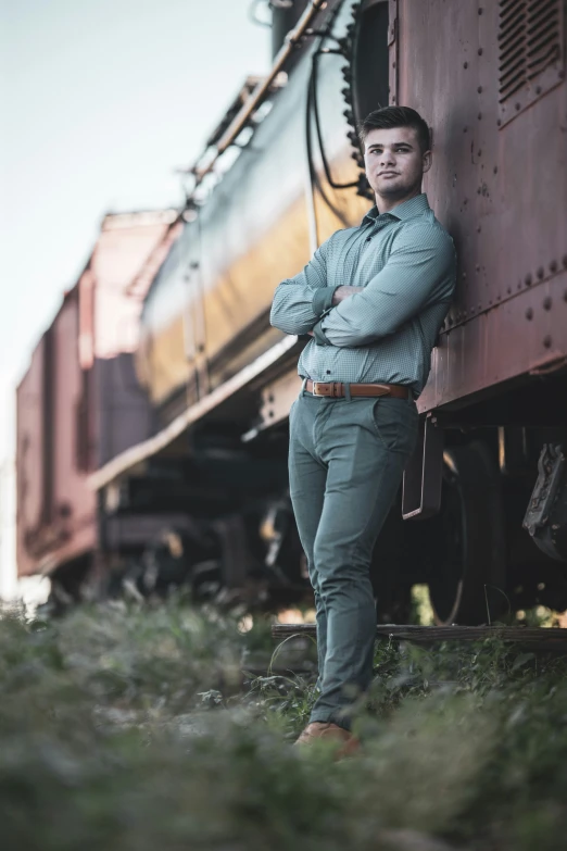 a man leaning against the side of a train