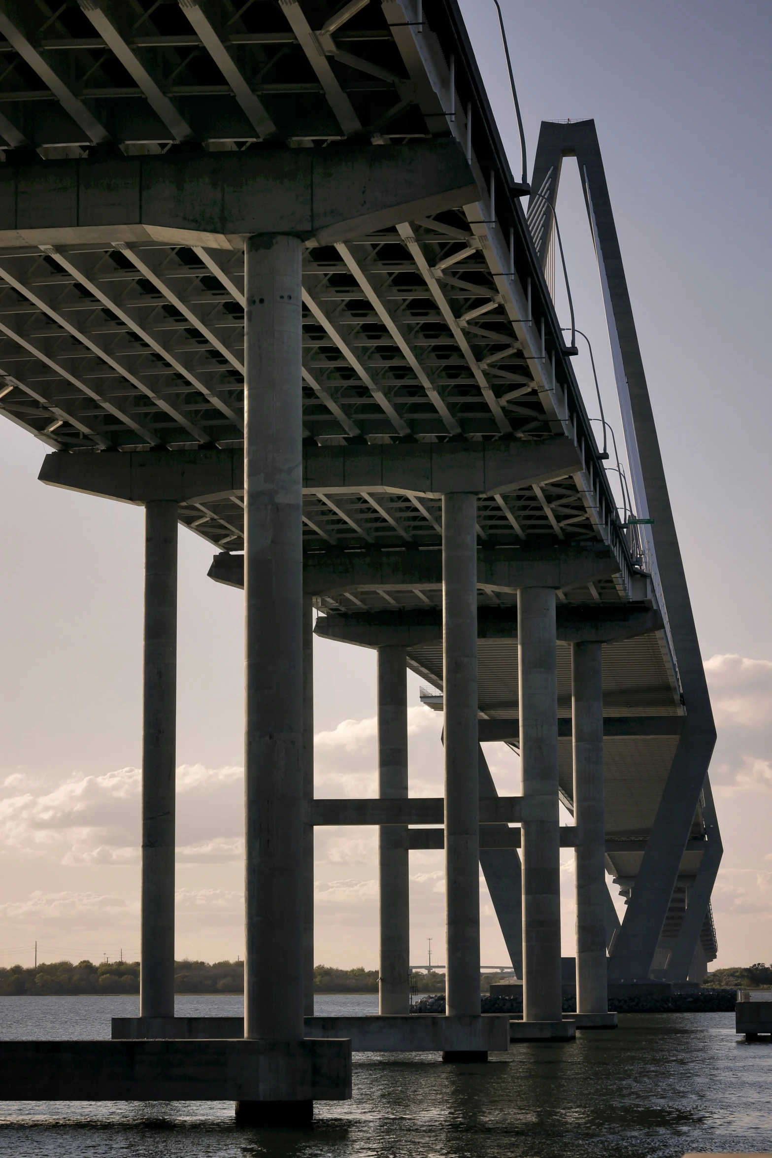 the view looking out from under a bridge