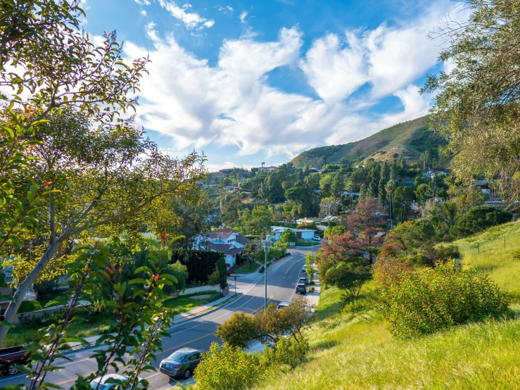 a scenic image of mountains and houses in a residential area