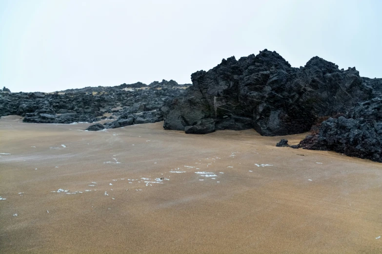 large rocks next to a pile of water