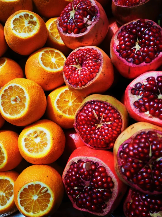 pomegranates and citrus fruit displayed for sale