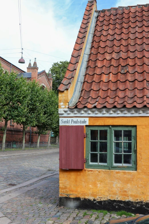 a large building that is made of red and yellow colors