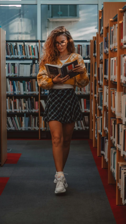 woman in liry reading a book wearing glasses and miniskirt