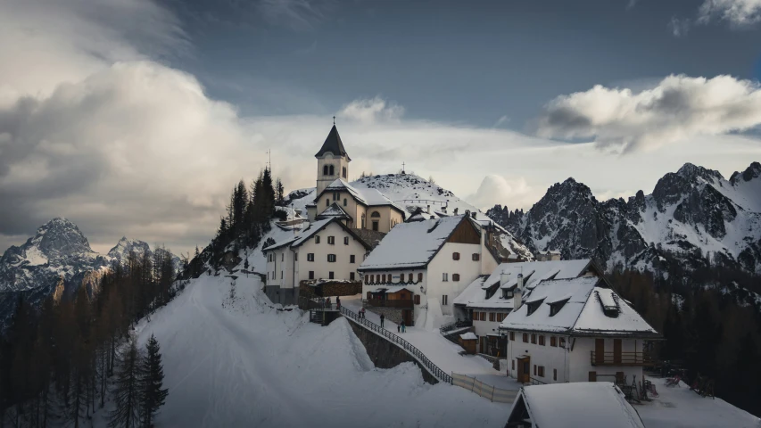 the village is on a snow covered hillside