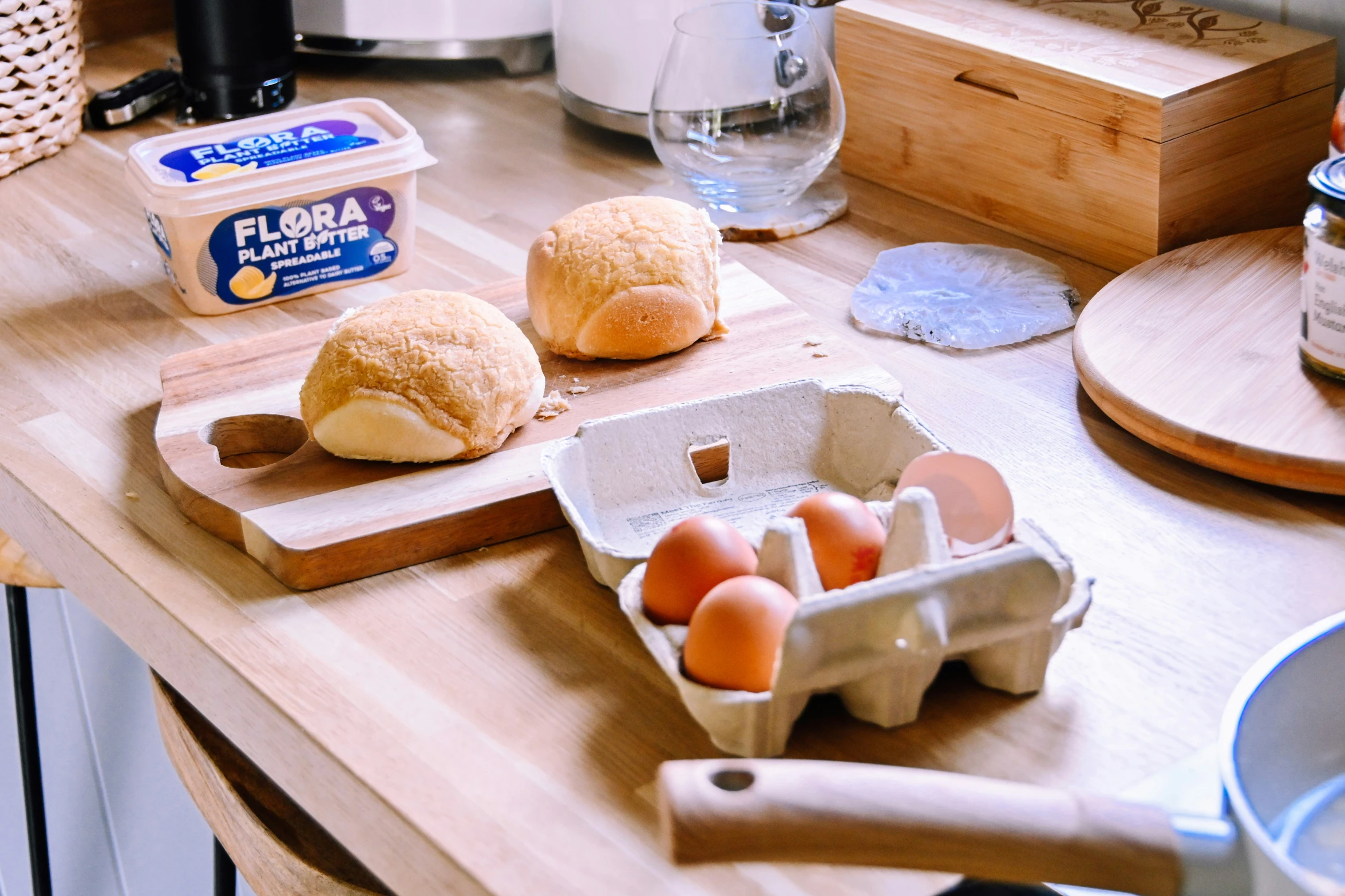 a table with buns and eggs on it