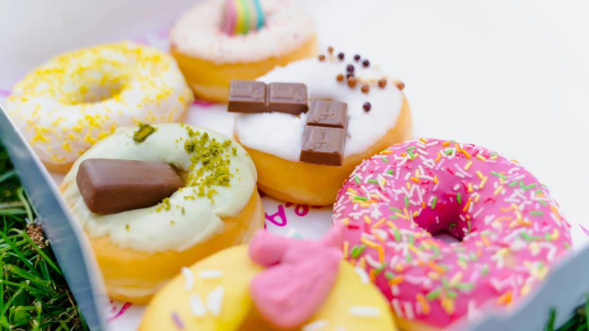 a box that has different kinds of donuts in it