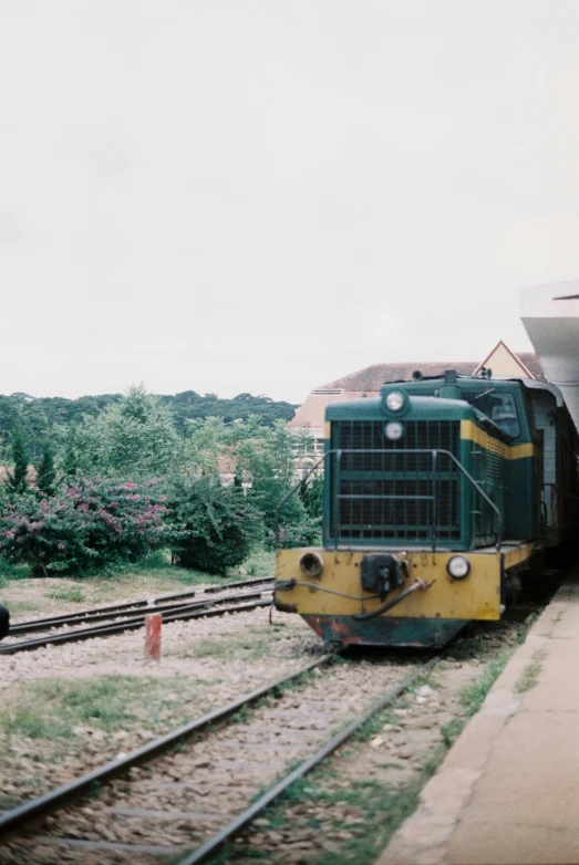 a train is pulling into a station where it is stopped
