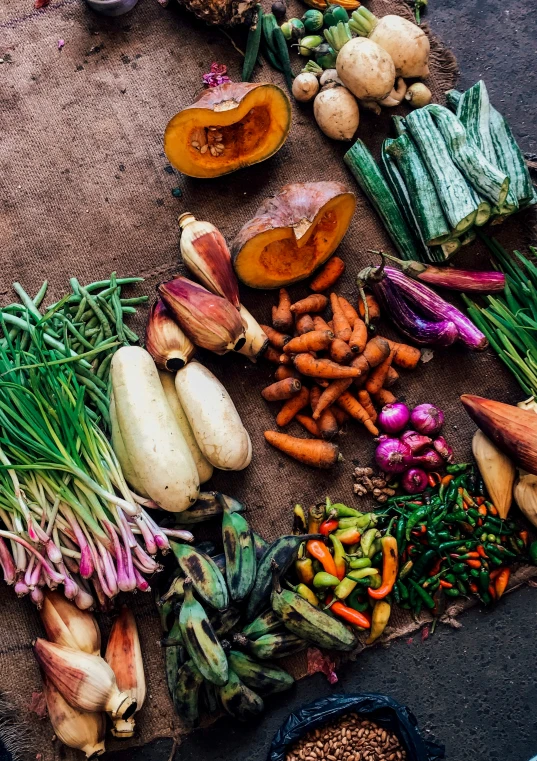 a bunch of vegetables laid out on the ground