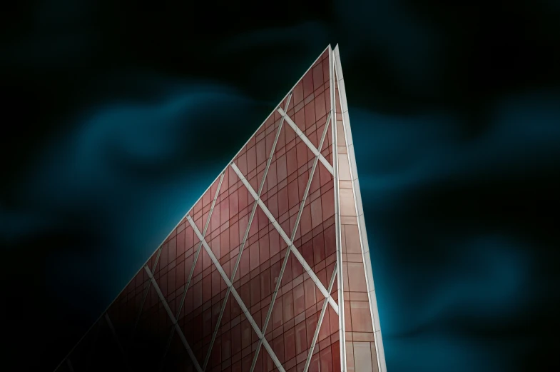 the top of a building in front of a dark sky