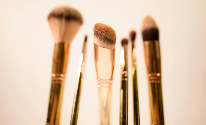 several makeup brushes are positioned close together