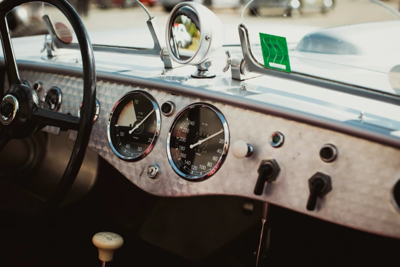 a classic sports car dashboard with gauges and dials