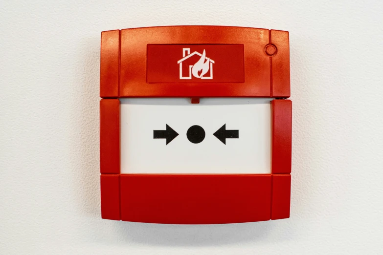 a small red electronic door with a door handle