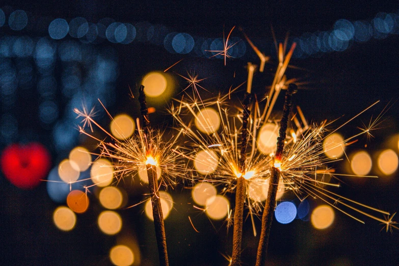 a close up of fireworks on a stick in the night