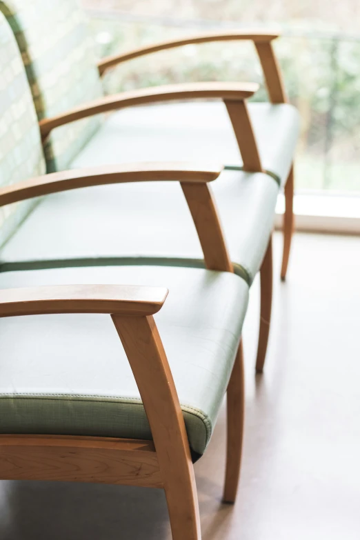 chairs next to each other in a room with windows