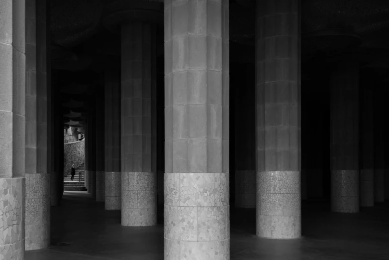 a black and white po of columns in a hall